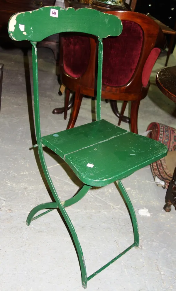 A pair of 20th green painted folding chairs, (2).