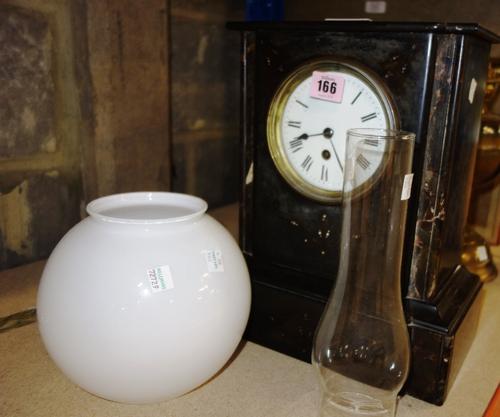 A Victorian marble mantel clock, a brass oil lamp and a pair of brass candlesticks, (4).