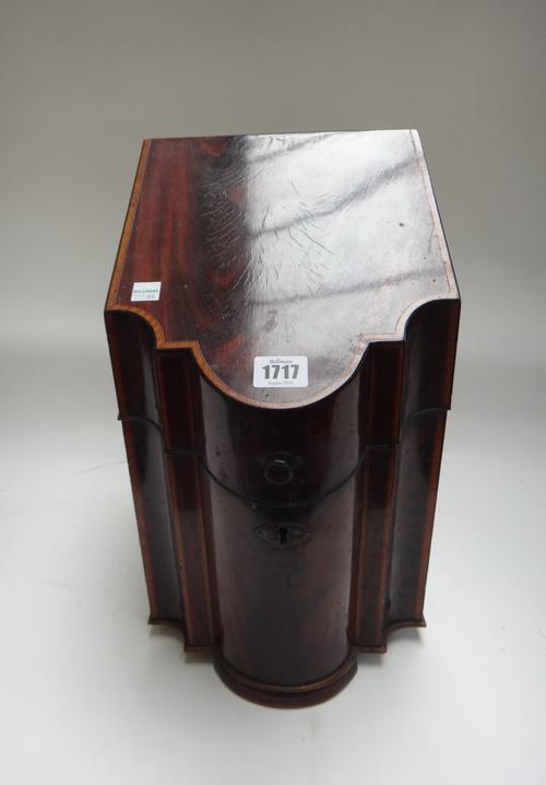 A George III inlaid mahogany slope front knife box with serpentine lid, later fitted with three decanters, 23cm wide.