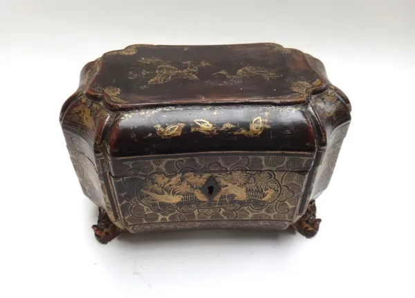 An early Victorian black lacquer chinoiserie decorated tea caddy of shaped compressed octagonal form, with twin lidded pewter interior, 21cm wide.