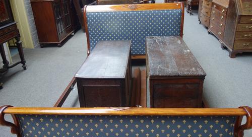 An Empire design mahogany framed double bed with swan head mounts and patera centred diamond decoration, on scroll feet, 160cm wide x 204cm long at ba