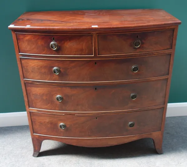 A Regency mahogany bow front chest of two short and three long graduated drawers, on splayed bracket feet, 106cm wide.