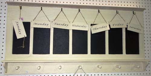 A 20th century white painted blackboard and a metal welcome sign.