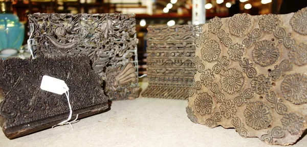A group of four printing blocks.