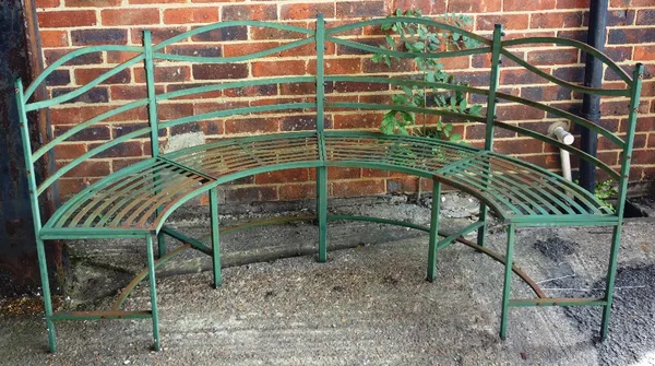 A Regency design green painted metal semi-elliptic garden bench, with slatted decoration, 175cm wide.