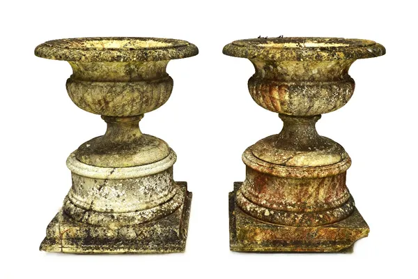 A pair of 19th century marble campana shaped garden urns, with semi fluted bodies, on turned socle and square bases, 60cm high, (2).   Illustrated