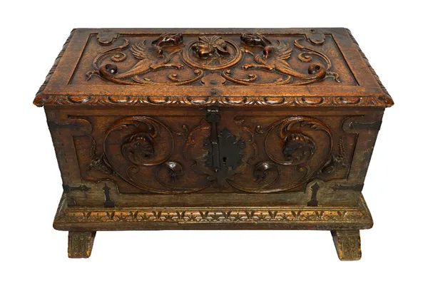 An 18th century Italian oak coffer, carved in high relief, the lid centred with a portrait mask, possibly of Augustus, flanked by winged beasts over f