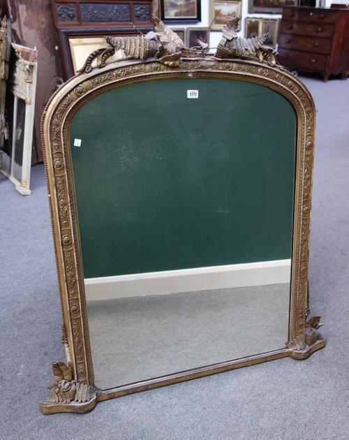 A 19th century gilt framed arch top wall mirror, with fern leaf decoration, 87cm wide x 119cm high, (a.f).