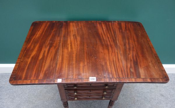 An early 19th mahogany drop flap work table, with pair of frieze drawers and dummy opposing, on tapering reeded supports, 50cm wide.