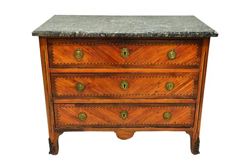 An 18th century French commode, the marble top over a tulipwood and kingwood three drawer gilt metal mounted base, on scroll feet, 98cm wide.  Illustr