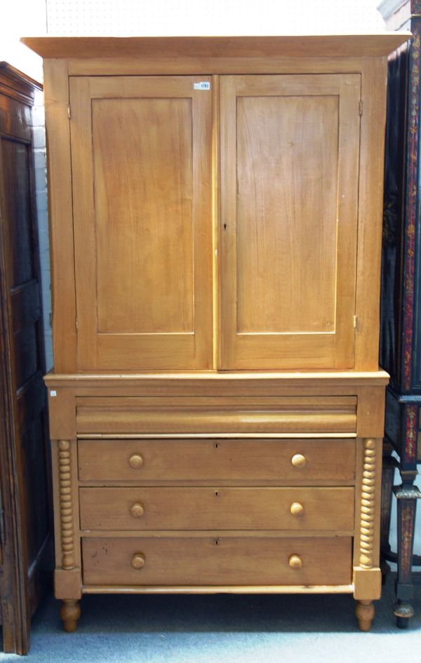 A Victorian faux oak scumble painted linen press, with pair of doors over four long drawers, flanked by split bobbin mounts, 126cm wide x 206cm high.