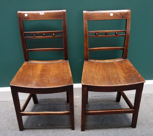 A pair of 18th century ash and elm Mendlesham chairs, with ball mounted waist rail and solid seat.