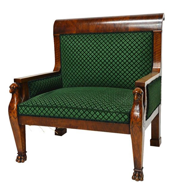 A French Empire style walnut framed armchair of large proportions, on bird's head and lion's paw mounts, 86cm wide.  Illustrated