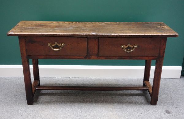 An 18th century and later small oak two drawer dresser base, on chamfered square supports, united by 'H' frame stretcher, 138cm wide.