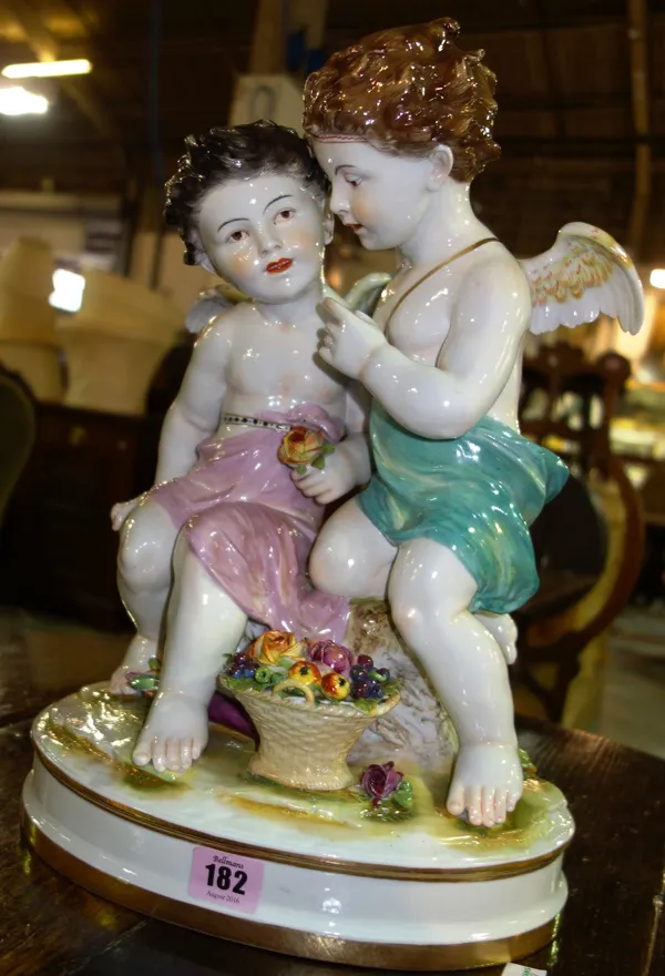 A German porcelain figure of a pair of cherubs.
