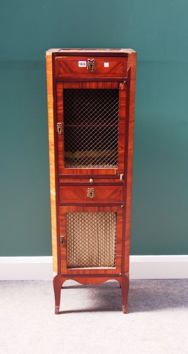 A late 19th century French kingwood tall narrow side cabinet, with two single drawers and brushing slide divided by a pair of grille cupboards, on sle