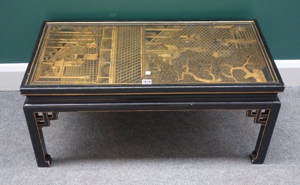 A 19th century Chinese black lacquer chinoiserie decorated panel, later mounted as a coffee table, 87cm long x 44cm wide.