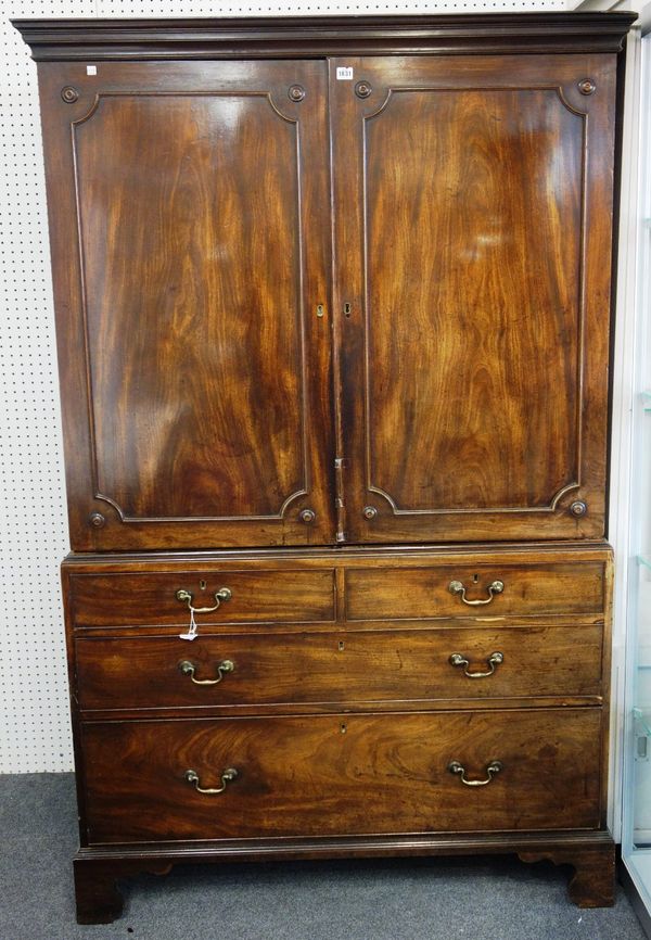 A George III mahogany linen press, with pair of panel doors and two short over two long graduated drawers, on bracket feet, 125cm wide x 199cm high.