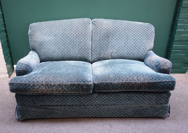 Howard & Sons, a mid 20th century two seat sofa, together with a matching armchair on tapering square supports, each stamped 'Howard Chairs Ltd, Londo