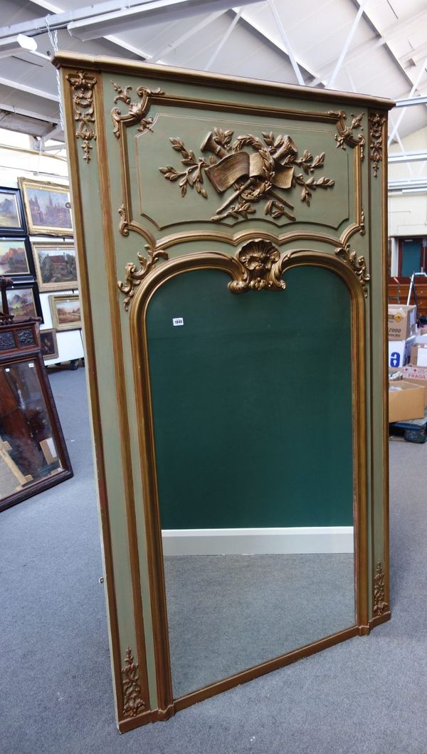 A large early 20th century French green painted parcel gilt wall mirror, the upper frieze relief moulded with laurel wreath tied horns and sheet music