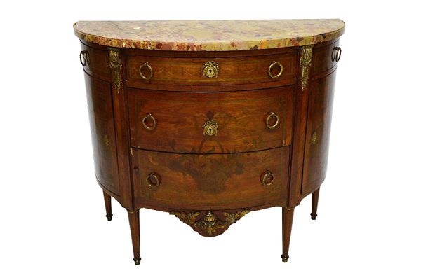 A 19th century French Louis XVI style demi-lune commode, the marble top over a floral marquetry inlaid gilt metal mounted mahogany base, of three long