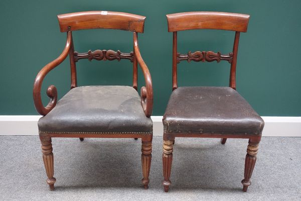 A set of twelve Regency mahogany dining chairs, with carved waist rail, on tapering reeded supports, including a pair of carvers, (a.f), (12).