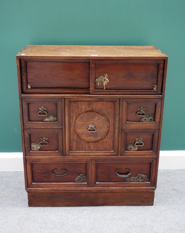 A late 19th century Chinese elm side cabinet, with an arrangement of doors, drawers and sliding panels, with painted lacquer decoration, 78m wide.