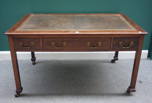 An 18th century style mahogany centre writing table, with three frieze drawers and matching opposing, on square supports, 136cm wide.