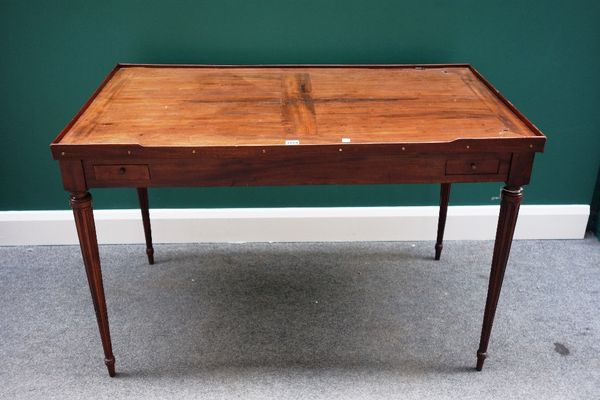 A late 18th century French inlaid mahogany Trick Track table, the reversible top revealing a fitted interior, over four frieze drawers, on tapering fl