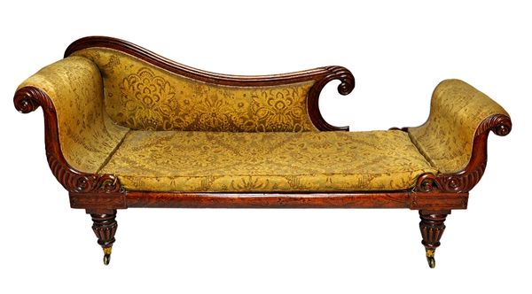 A William IV faux rosewood chaise longue, with carved double end scrolls, on tapering reeded supports, 195cm wide.  Illustrated