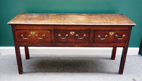 An 18th century oak dresser base, with three frieze drawers, on square supports, 156cm wide.