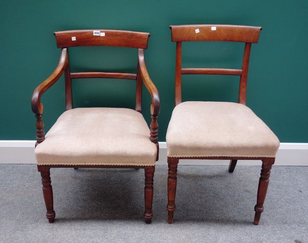 A set of eight early 19th century mahogany framed dining chairs, with straight front seat on turned supports, to include a pair of carvers, (8).