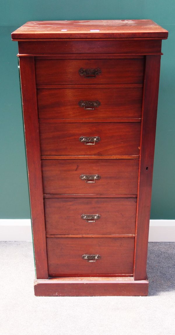 A late Victorian mahogany Wellington chest, the six graduated drawers enclosed by side locking bar, on plinth base, 57cm wide.