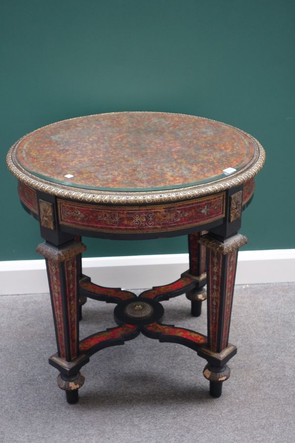 A Louis XVI style gilt metal mounted faux tortoiseshell circular centre table, on tapering square supports, united by 'X' frame stretcher, 78cm wide.