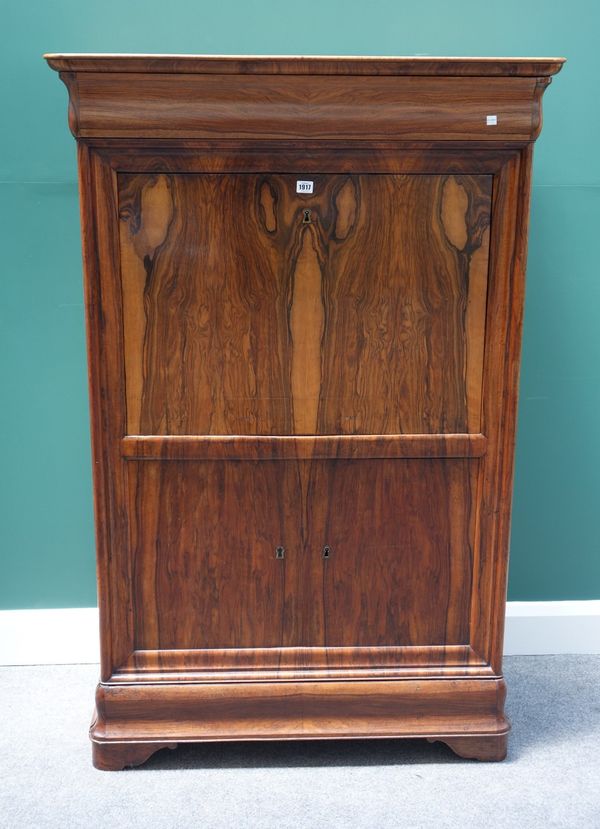 A 19th century figured walnut secretaire a abattant, the cushion frieze drawer over fall front, revealing a fitted interior above a pair of lower pane