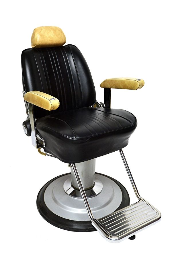 Takara Belmont Product of Japan; a mid 20th century cream and black leatherette upholstered barber's chair, with height adjustment column and angled b