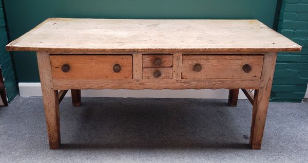 An early 19th century pine and oak preparation table, with four frieze drawers on tapering square supports, 83cm x 186cm.