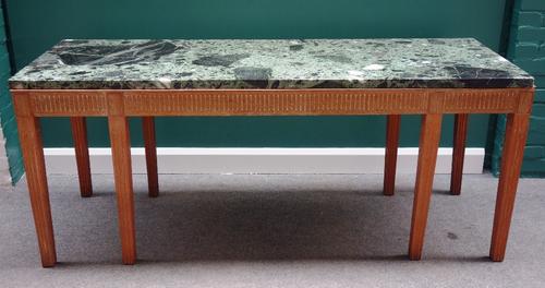 A 20th century serving table, the rectangular marble top with fluted frieze and tapering square supports, 190cm wide.
