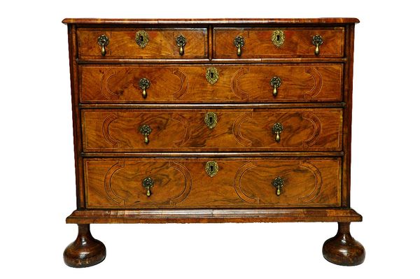 A William and Mary walnut chest, the geometric inlaid top over two short and three long graduated drawers, on bun feet, 94cm wide.