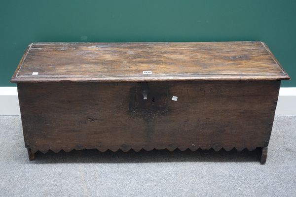 A 17th century oak five plank coffer, with chevron dog tooth frieze and slab end supports, 101cm wide.