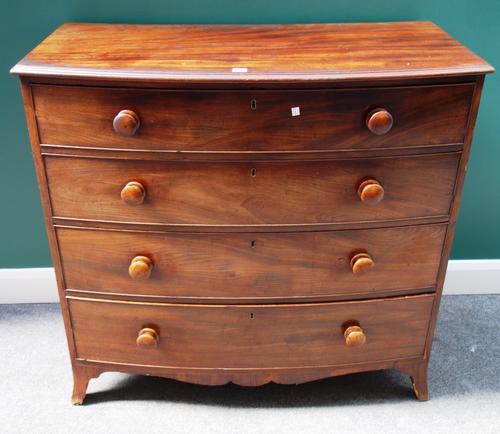 An early 19th century mahogany bowfront chest of four long graduated drawers, on splayed bracket feet, 109cm wide.