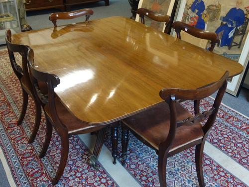 A George IV mahogany rectangular snap top dining table, on square column and four downswept supports, 121cm x 153cm.