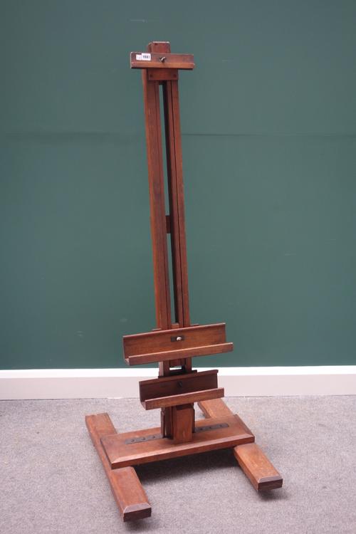 An early 20th century stained beech artist's easel on an 'H' frame base.