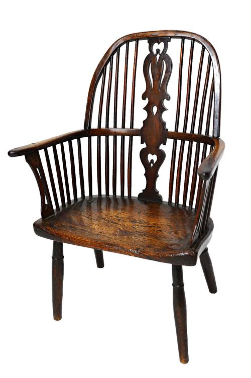 A George III and later ash and elm bow back Windsor chair, with pierced splat and solid seat, on turned supports.  Illustrated
