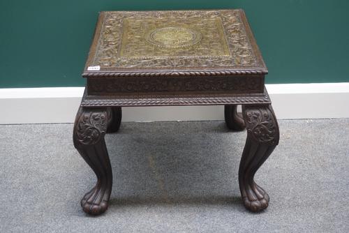 An early 20th century Chinese black lacquer chinoiserie decorated miniature alter table, 61cm wide,  an Eastern embossed brass veneered square occasio
