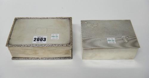 A silver rectangular table cigarette box, wooden lined within, the exterior engine turned and with moulded floral borders, London 1925 and another sma