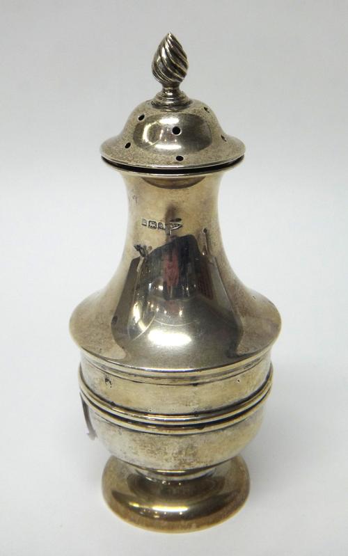 A silver sugar caster, with a wrythen knop finial and on a circular foot, Sheffield 1911, weight 196 gms.