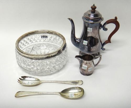 A silver mounted faceted glass salad bowl, probably London 1931, a pair of silver salad servers, London 1928, a plated coffee pot and a plated milk ju