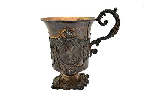 A Russian mid-19th century silver mug, the body decorated with circular plaques depicting the portraits of nobility, within cartouche shaped surrounds