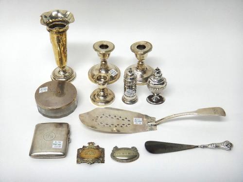 Silver and silver mounted wares, comprising; a rectangular cigarette case, Birmingham 1942, a fiddle pattern fish slice, a vase, a pair of candlestick